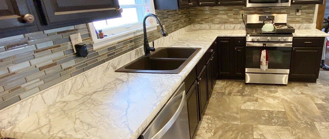 Laminate countertops are moderately durable and available in a wide variety of colors and patterns. Laminate is an inexpensive option that makes it popular for those who want to change their kitchen's look and feel without the permanence and investment of more expensive materials.